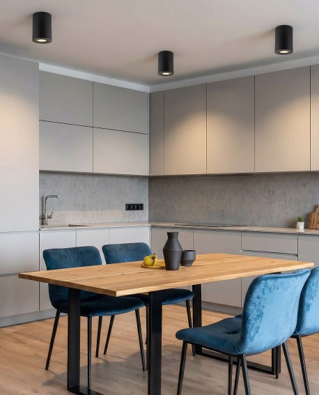 minimalistyczna lampa natynkowa spot tuba w kolorze czarnym zastosowana nad stołem od marki Lampit wersja Nati W1