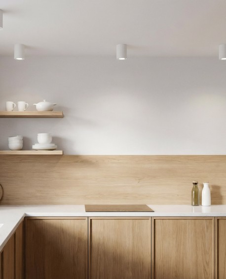 punktowe oświetlenie sufitowe w formie białych tub montowanych natynkowo we wnętrzu z aranżacją lamp Nati W1 marki Lampit