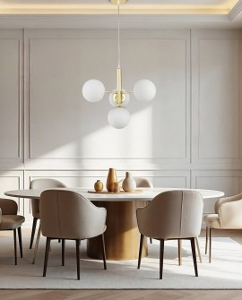 szlachetna lampa wisząca złota z harmonijnym układem kul eleganckie dopełnienie strefy dziennej lampit LEDO W4