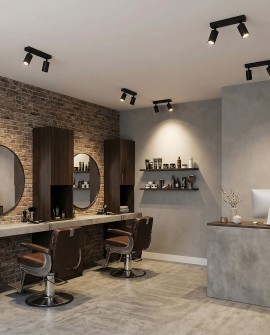 czarne lampy sufitowe LED Lampit w salonie fryzjerskim oświetlające stanowiska pracy i przestronny wystrój