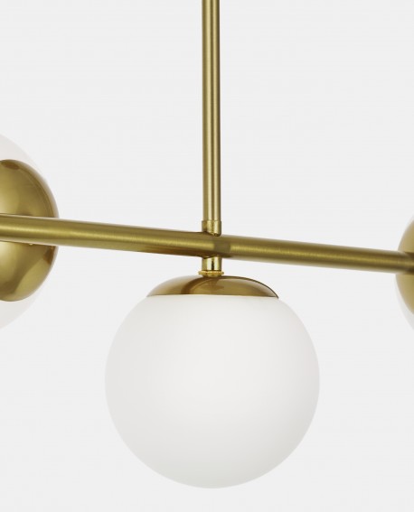 Szklany element abażuru na tle złotej ramy lampy LEDO W3 Long