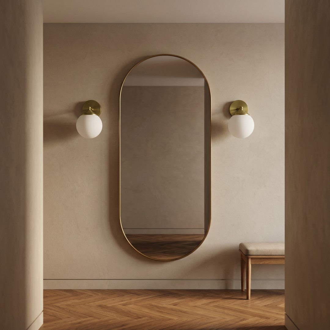 Nowoczesna lampa ścienna FINO W1 Lampit złota z kulą w aranżacji przy lustrze