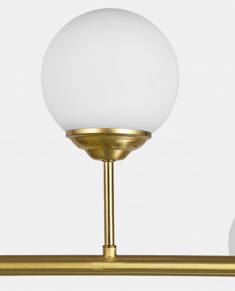 Detal złotego elementu i szklanego klosza lampy FINO W6