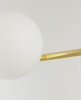 Fragment kulistego klosza lampy LEDO W3 z widocznym złotym metalowym elementem