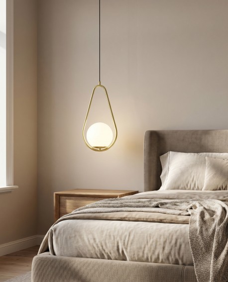 Wisząca lampa Vero 1C w kształcie kropli nad strefą relaksu w sypialni