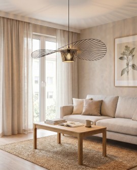 Nowoczesna czarna lampa SOMBRERO D100 o ażurowej formie nad stolikiem kawowym w przestronnym salonie