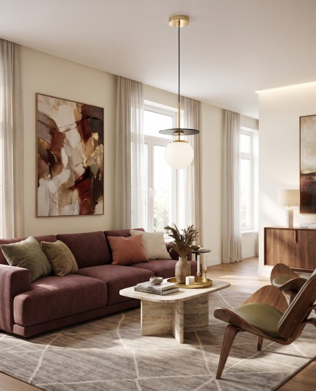 Czarno złota lampa wisząca Daltona stanowiąca centralny punkt oświetlenia w dużym salonie