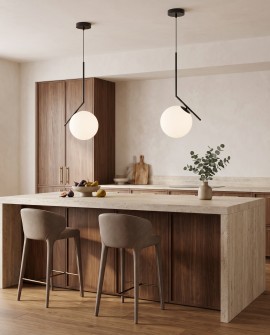 Czarna lampa wisząca z białym szklanym kloszem nad wyspą kuchenną w aranżacji